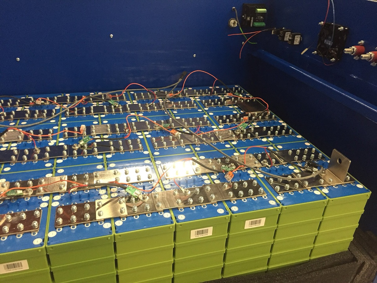 Large rectangular LFP battery cells with blue terminals.
